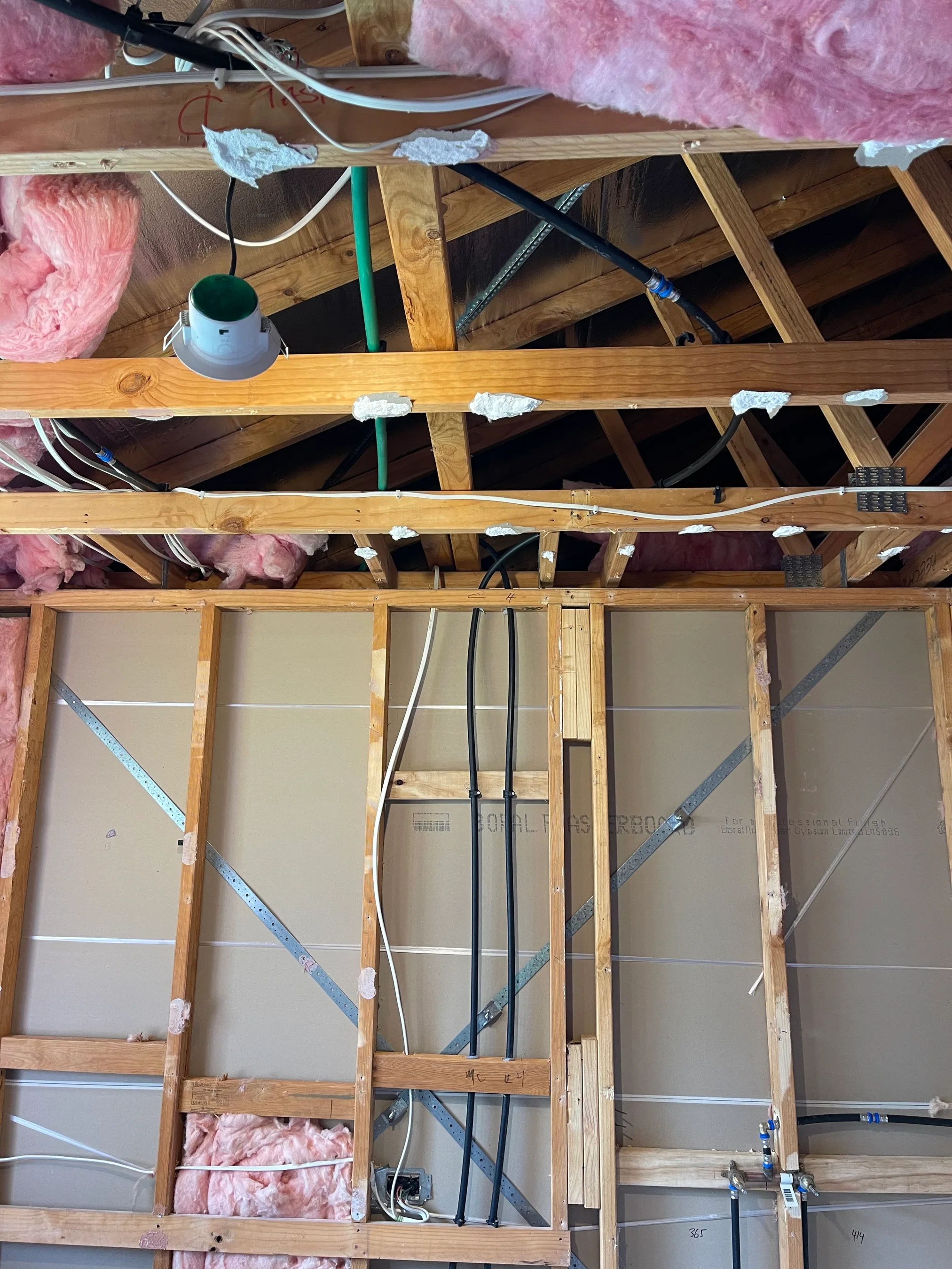 Electrical and plumbing rough-in through timber wall and ceiling framing