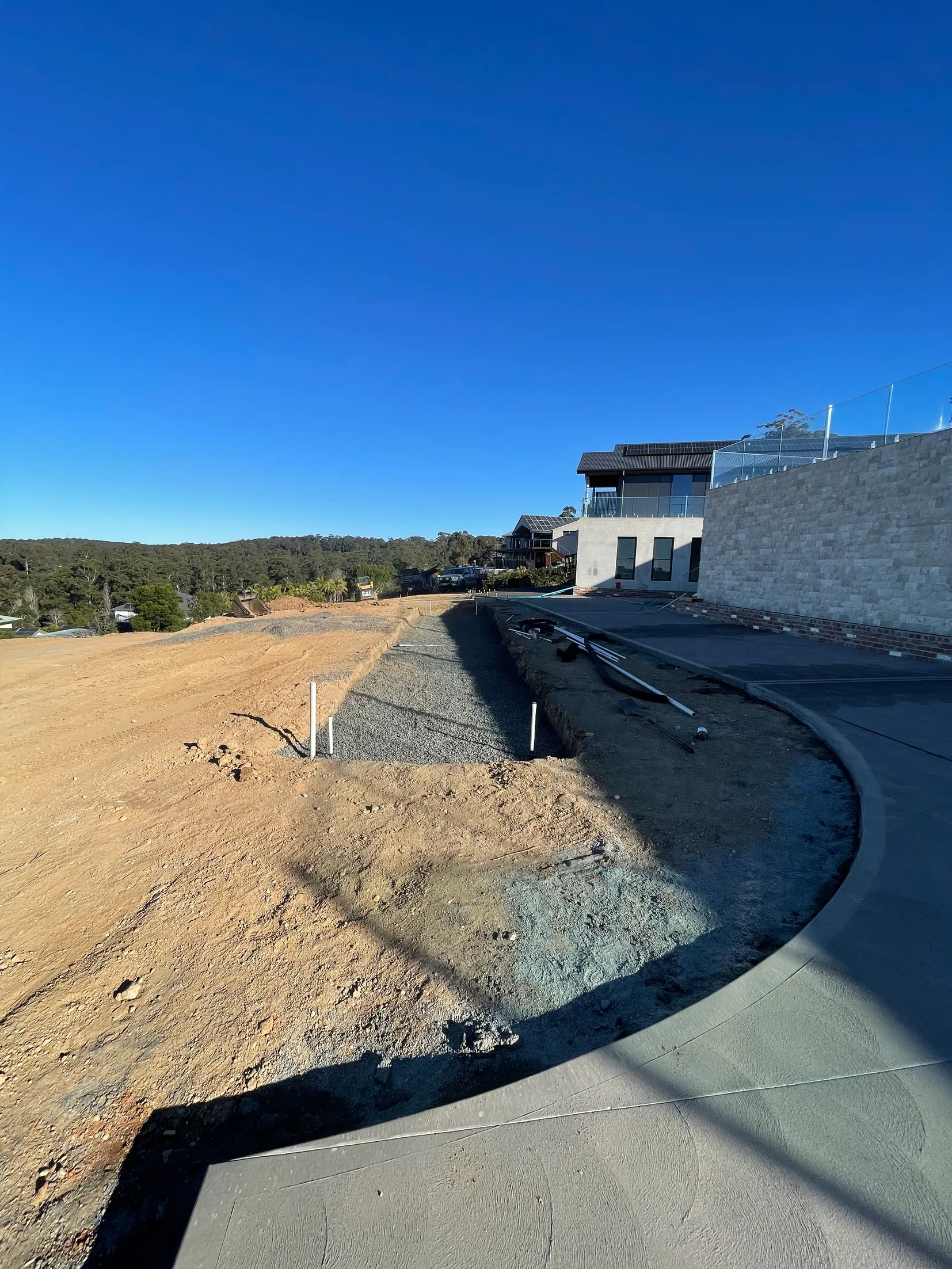 Residential site drainage works overlooking bushland near Batemans Bay